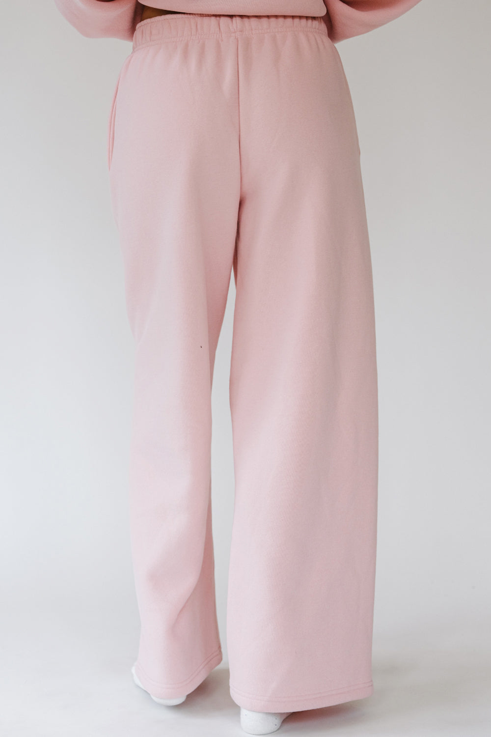 Back of the light pink Puff Series Sweatpants, wide leg fit. The Happy Camp3r
