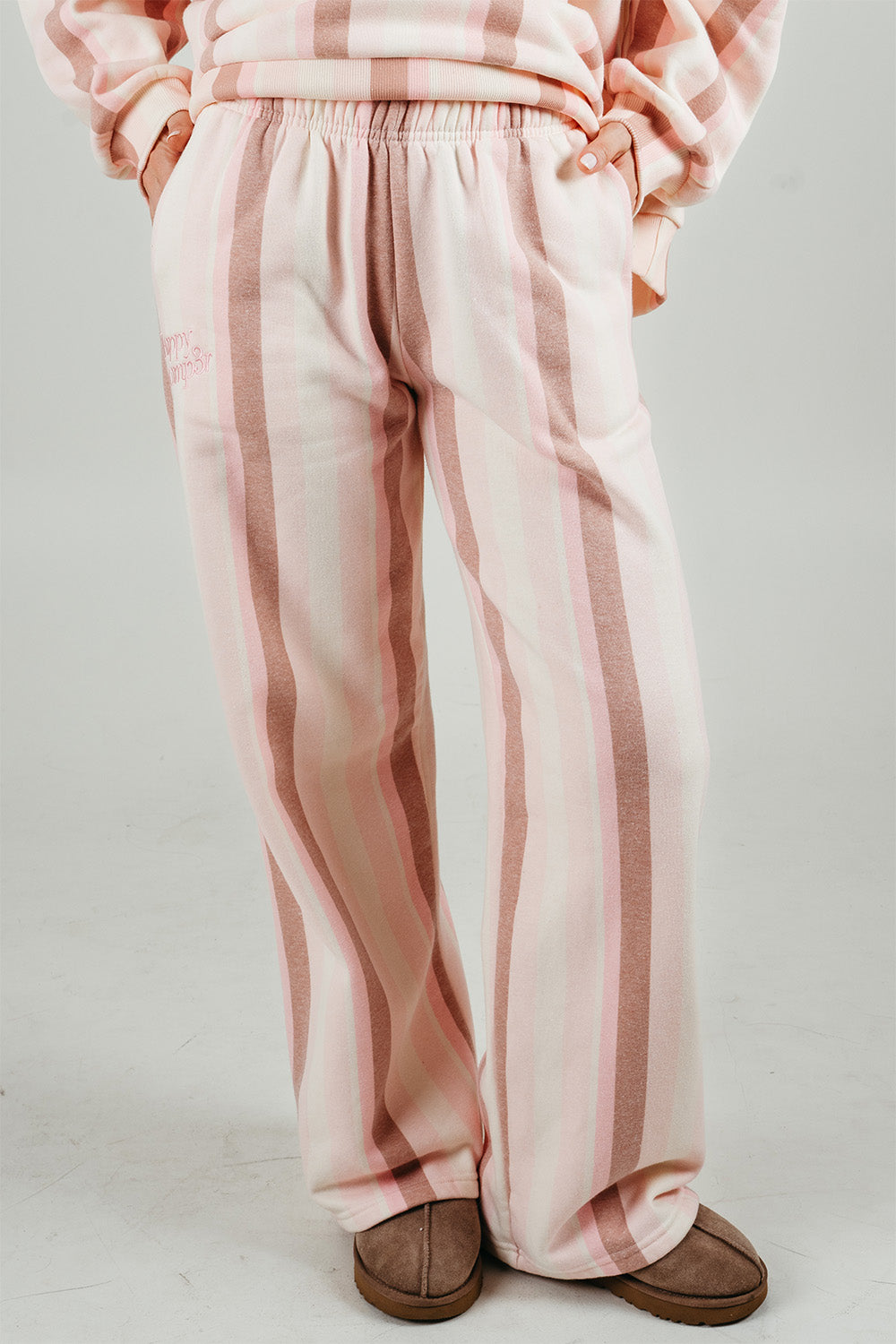 Sundae Stripes Sweatpants in pink and cream stripes, front view. The Happy Camp3r