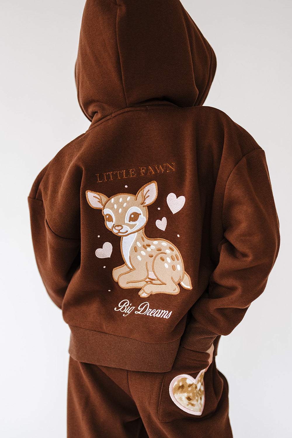 Back of the Fawn Love Youth Zip Up Hoodie with fawn and hearts graphic. The Happy Camp3r
