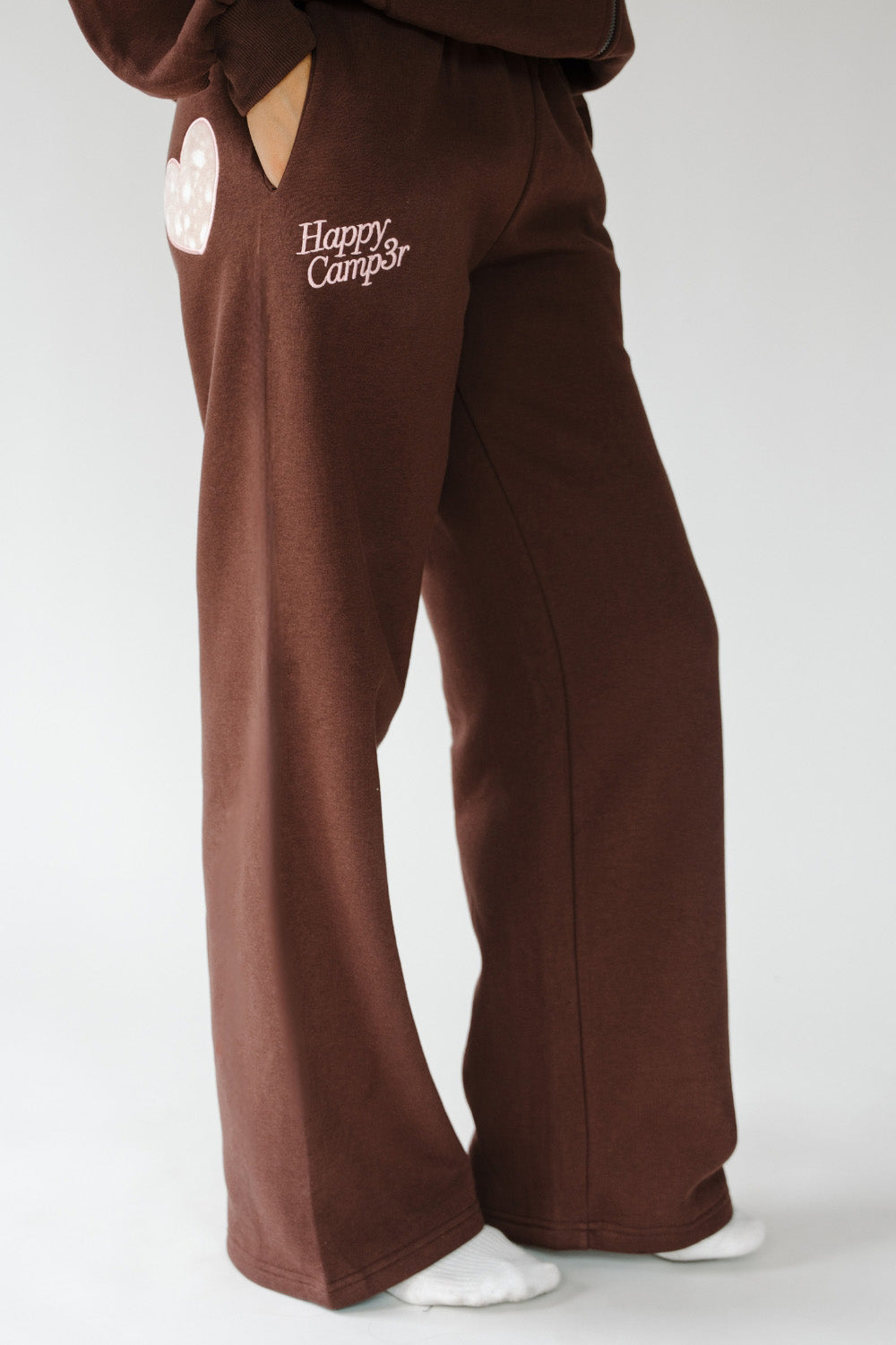 Fawn Love Sweatpants in brown with cream Happy Camp3r logo, side view. The Happy Camp3r